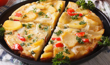 omelet with potatoes, zucchini, tomatoes, cheese
