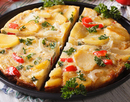 omelet with potatoes, zucchini, tomatoes, cheese