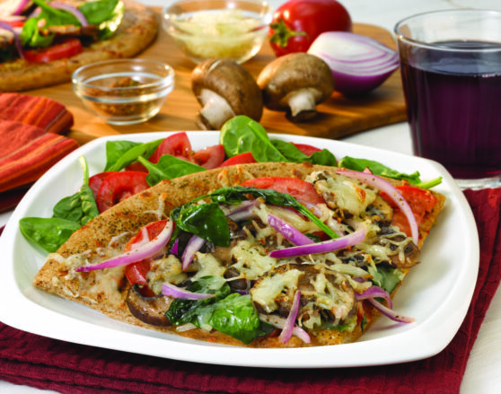 slice of pizza topped with peppers, onions and mushrooms