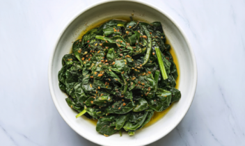 sauteed spinach in a white bowl