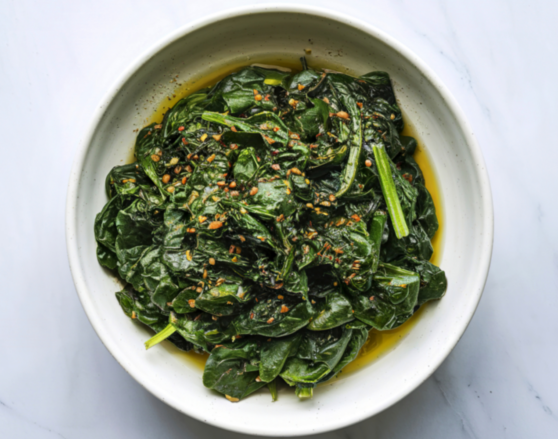tahini spinach_ofelia-diaconus-images_canva sauteed spinach in a white bowl