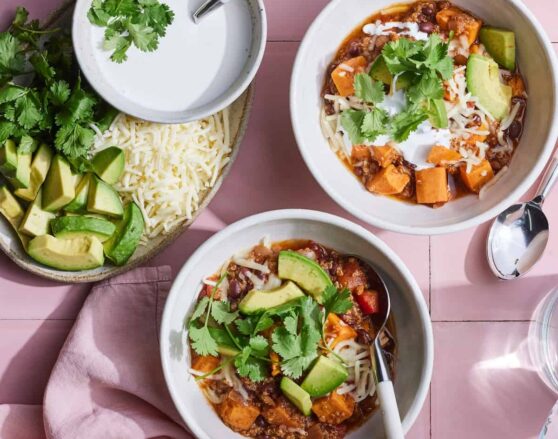 WGC-__-Black-Bean-Sweet-Potato-Chili-1 bowls of black bean sweet potato chili topped with avocado and cilantro