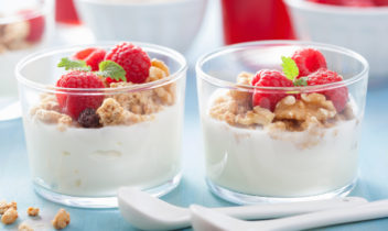 A healthy granola raspberry yoghurt breakfast