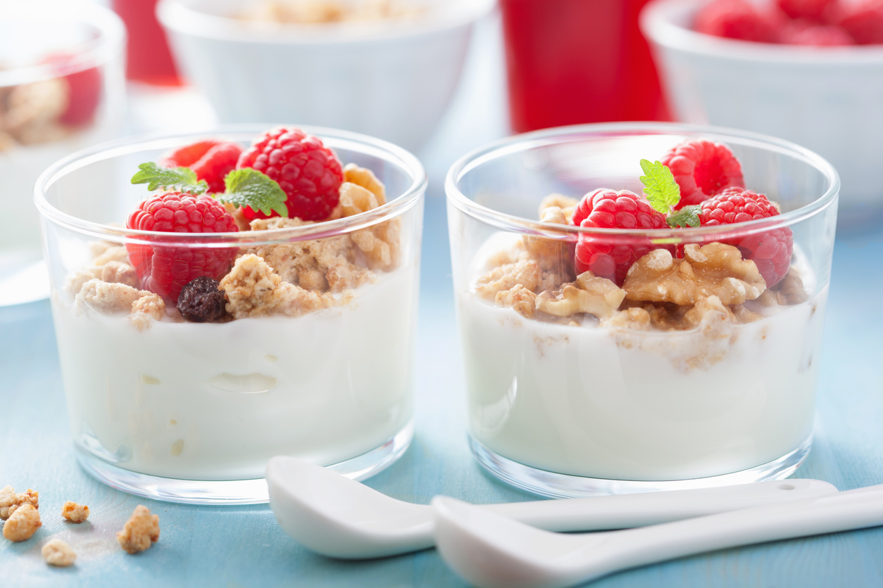 A healthy granola raspberry yoghurt breakfast