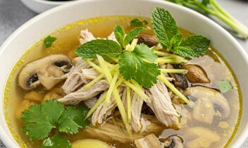 lemongrass soup_Gemini_Generated_Image_8dpnkj8dpnkj8dpn bowl of lemongrass chicken soup with mushrooms topped with fresh herbs