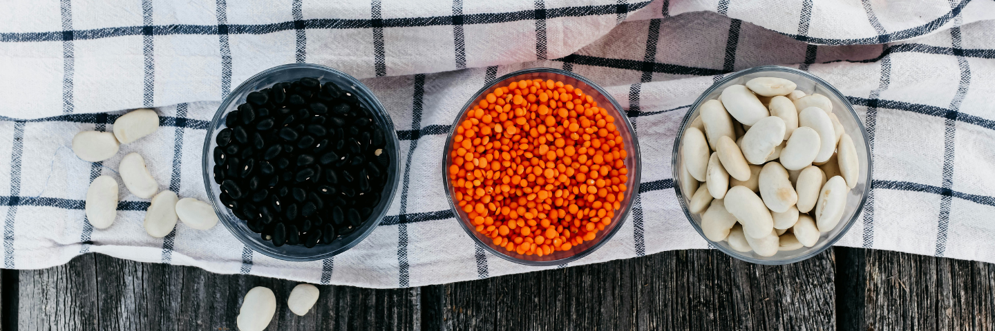bowls of black beans, red lentils and white beans