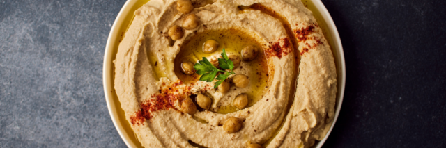 bowl of hummus with paprika on top