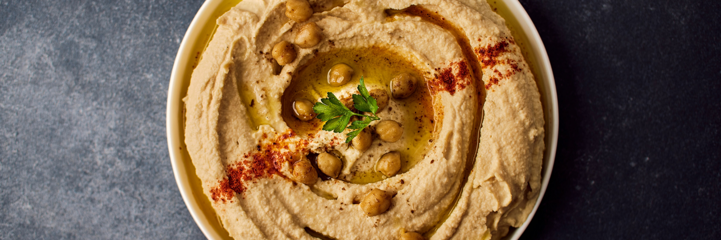 bowl of hummus with paprika on top