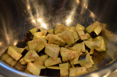 Add diced eggplant. Toss to coat evenly. Sprinkle lightly with S&P.