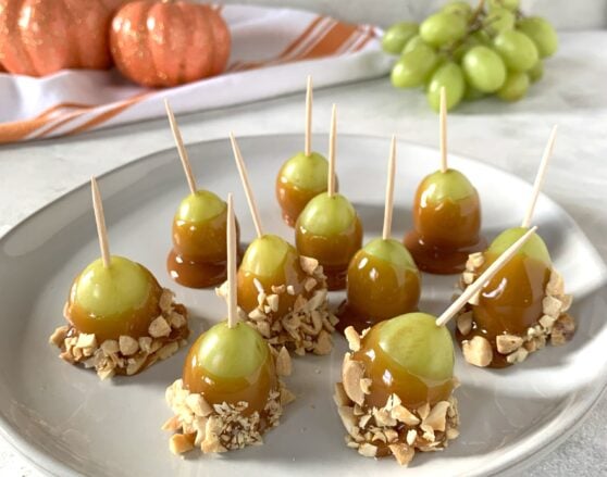 green grapes dipped in caramel and crushed peanuts