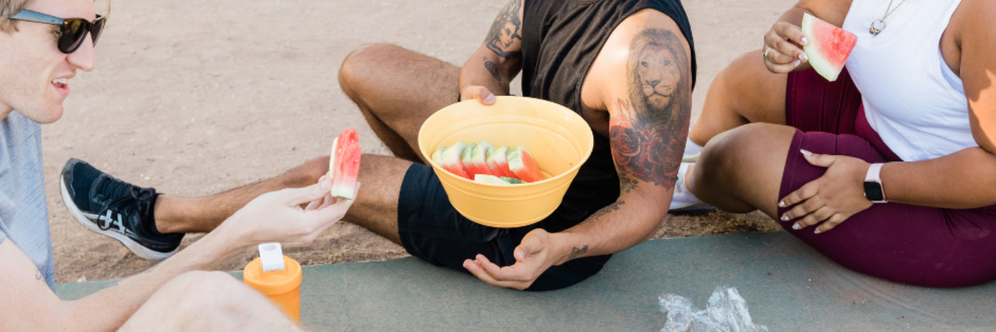 people eating watermelon after working out