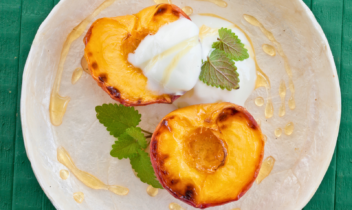 grilled peach halves topped with greek yogurt and drizzle of honey