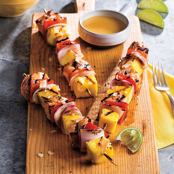 grilled pineapple chunks and cubed salmon on skewers