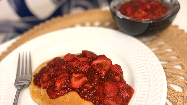 strawberry chia sauce over pancakes