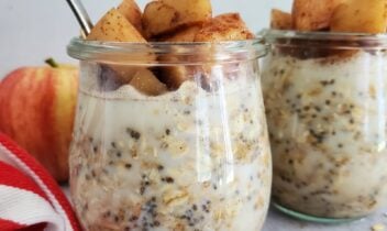 mason jar filled with overnight oats topped with cinnamon apples